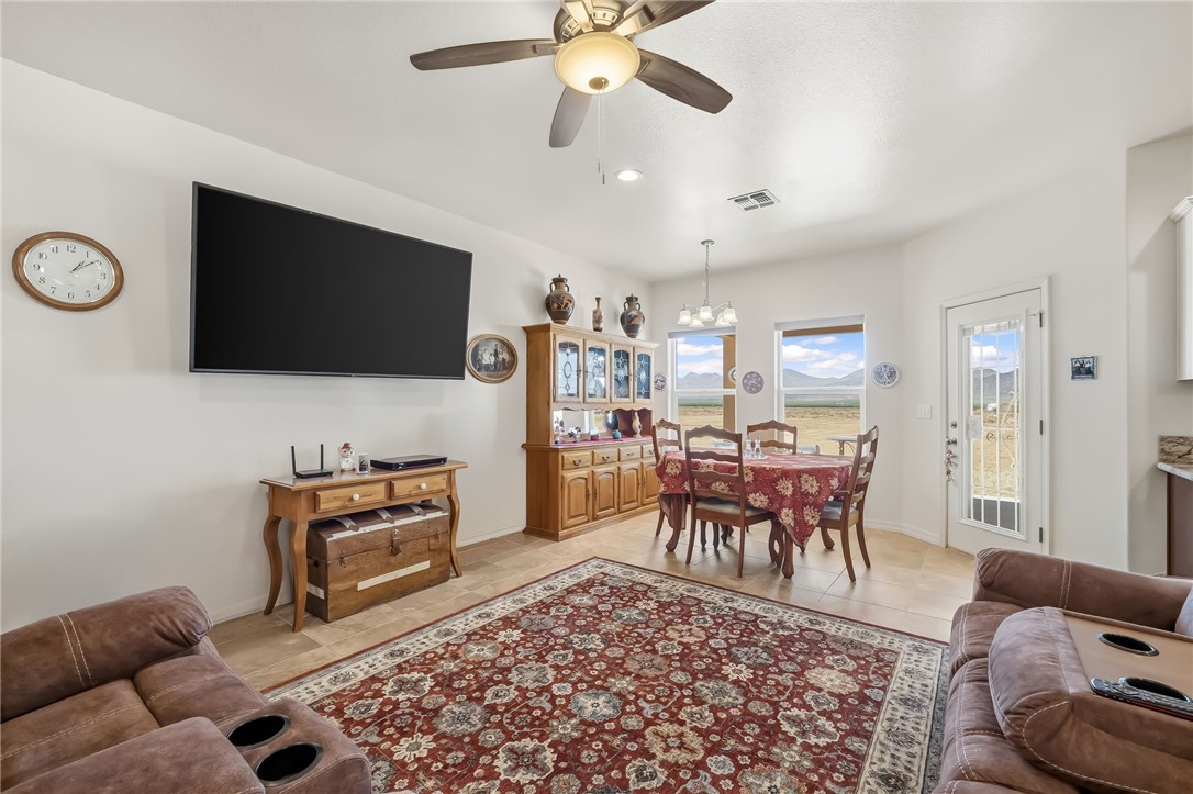 10809 North Jemez Road Kingman, AZ 86401 - Photo 6 of 51 Open-concept living area featuring light-toned tile flooring, recessed lighting, and a ceiling fan