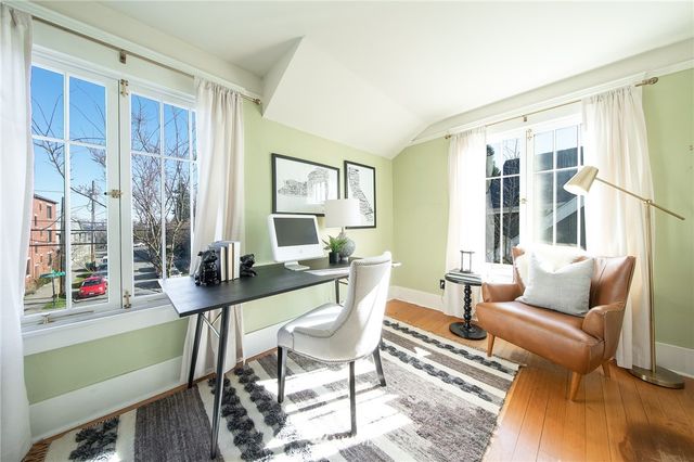 a view of a livingroom with furniture and window
