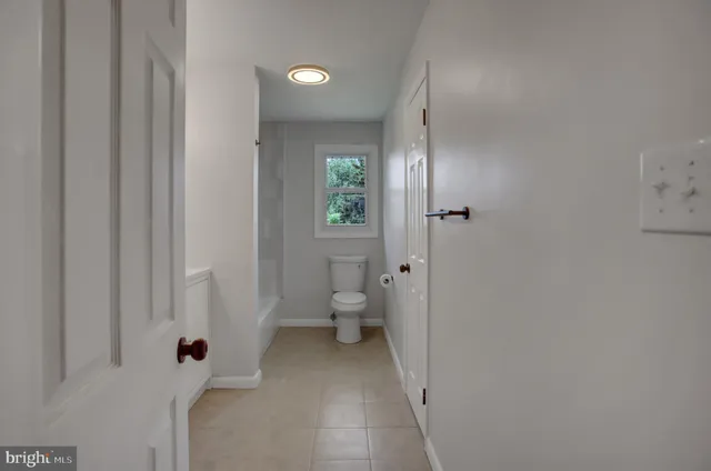 a bathroom with a sink and toilet