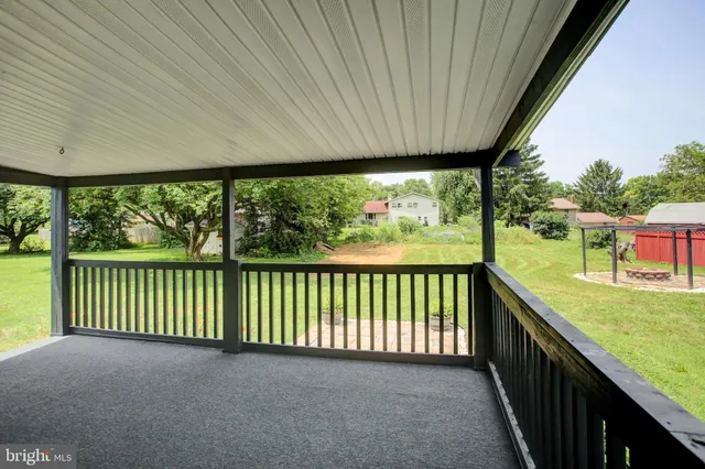 a view of a porch and garden