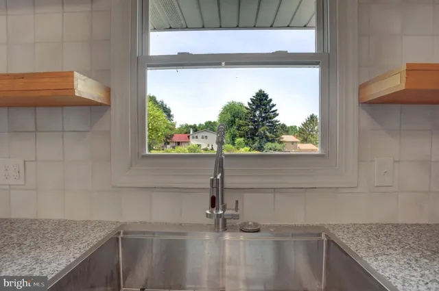 a kitchen with a sink and a window