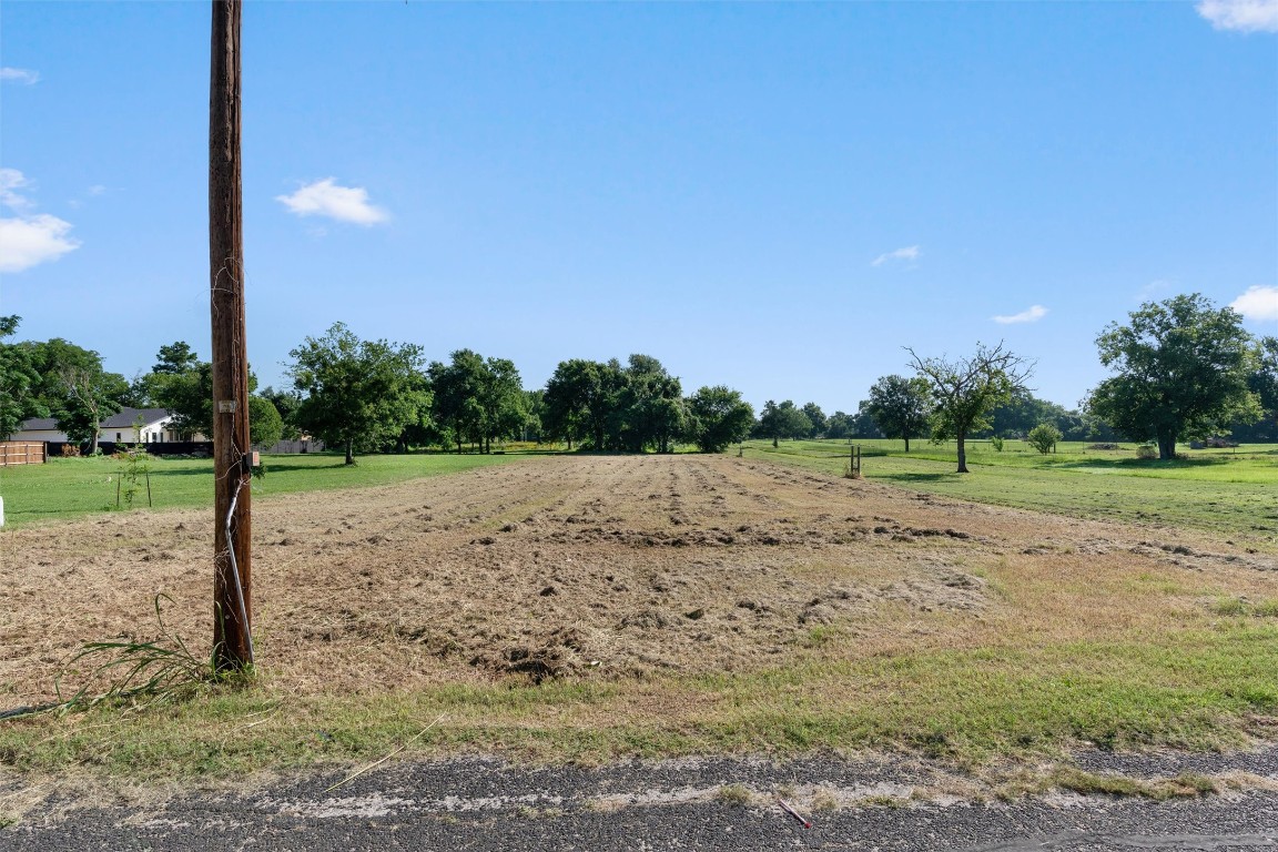 0 Q.S. Goins Lane Elgin, TX 78621 - Photo 6 of 12 a view of a road with a yard