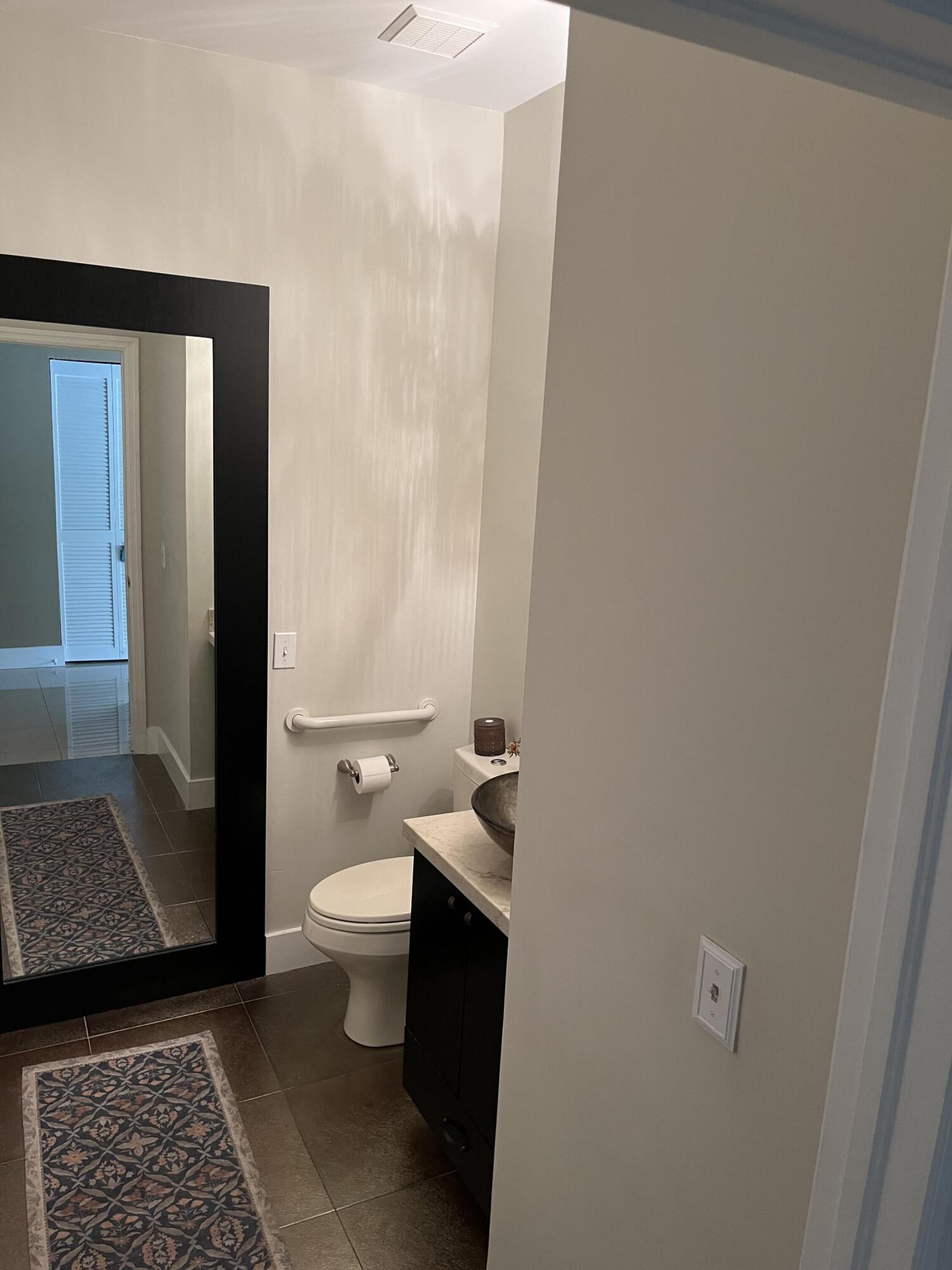 17651 Tiffany Trace Drive Boca Raton, FL 33487 - Photo 12 of 17 a bathroom with a toilet and a shower