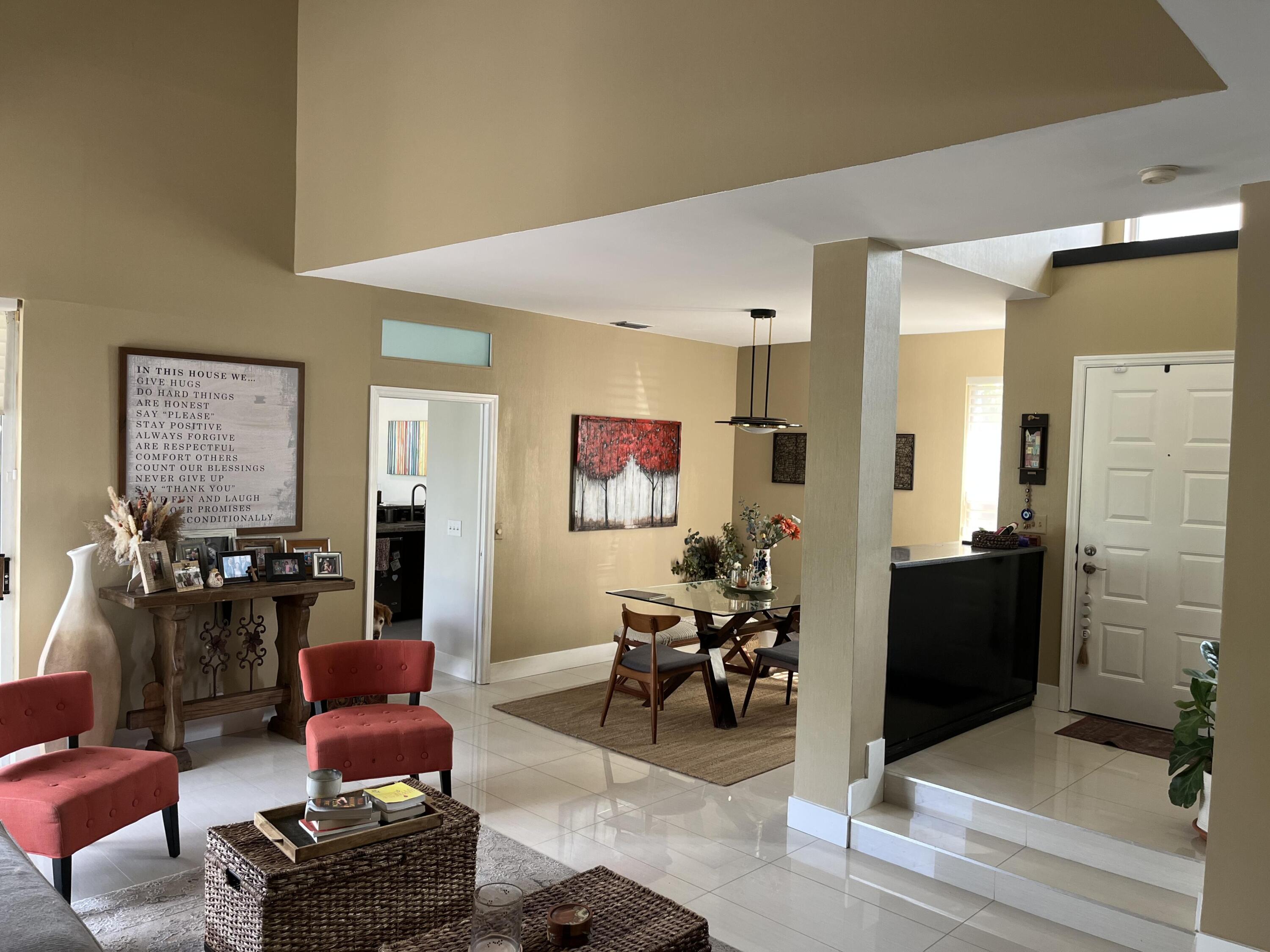 17651 Tiffany Trace Drive Boca Raton, FL 33487 - Photo 2 of 17 a living room with furniture and a flat screen tv
