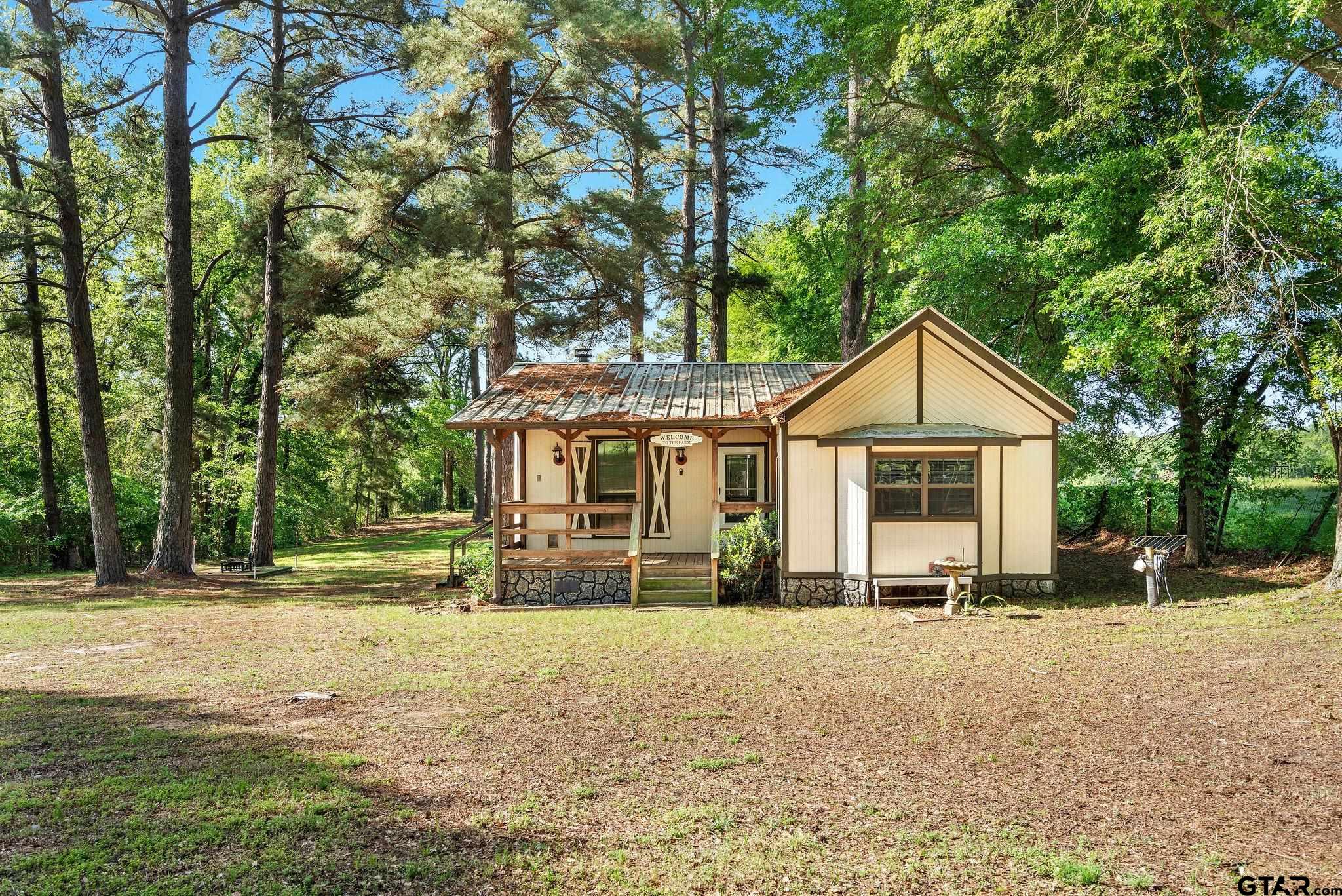 4550 Crabapple Road Gilmer, TX 75645 - Photo 27 of 33 a front view of a house with a yard
