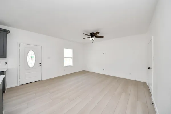 a view of an empty room with a window