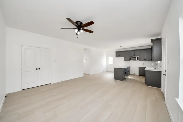 a view of a livingroom with a kitchen