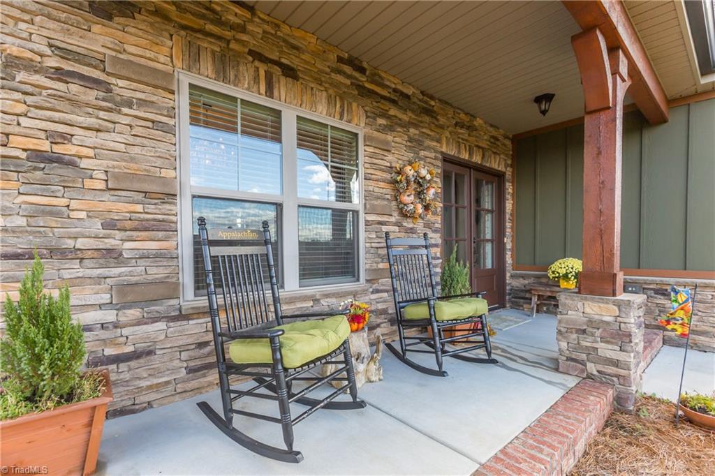 Watch the sunset behind the mountains from the rocking chair front porch