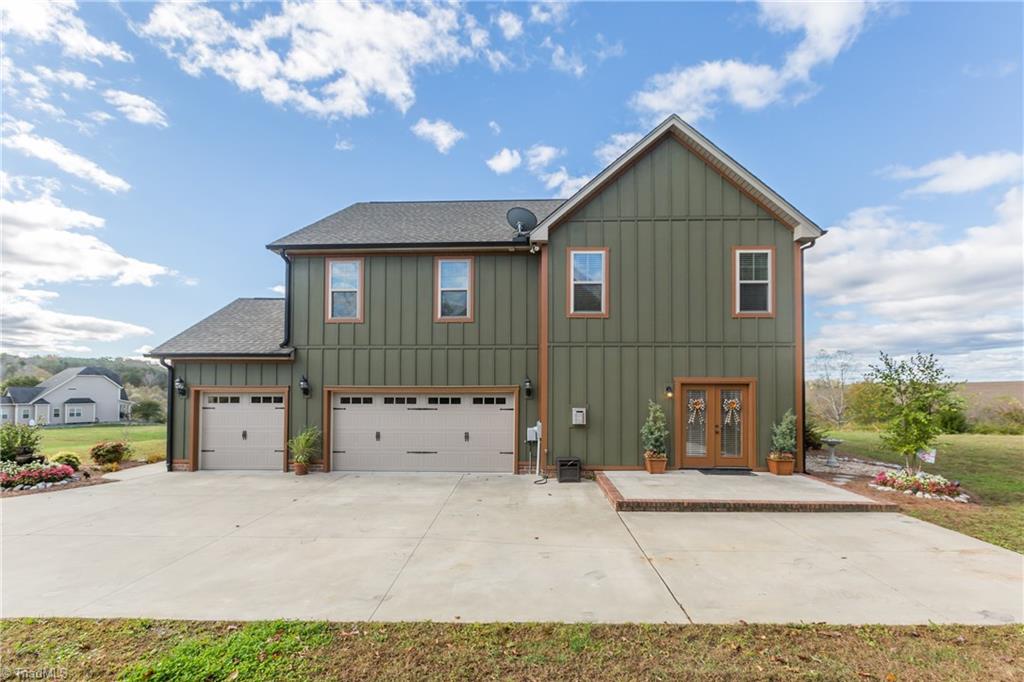 105 Mountain Ridge Court King, NC 27021 - Photo 9 of 43 Rear view of the home with raised patio