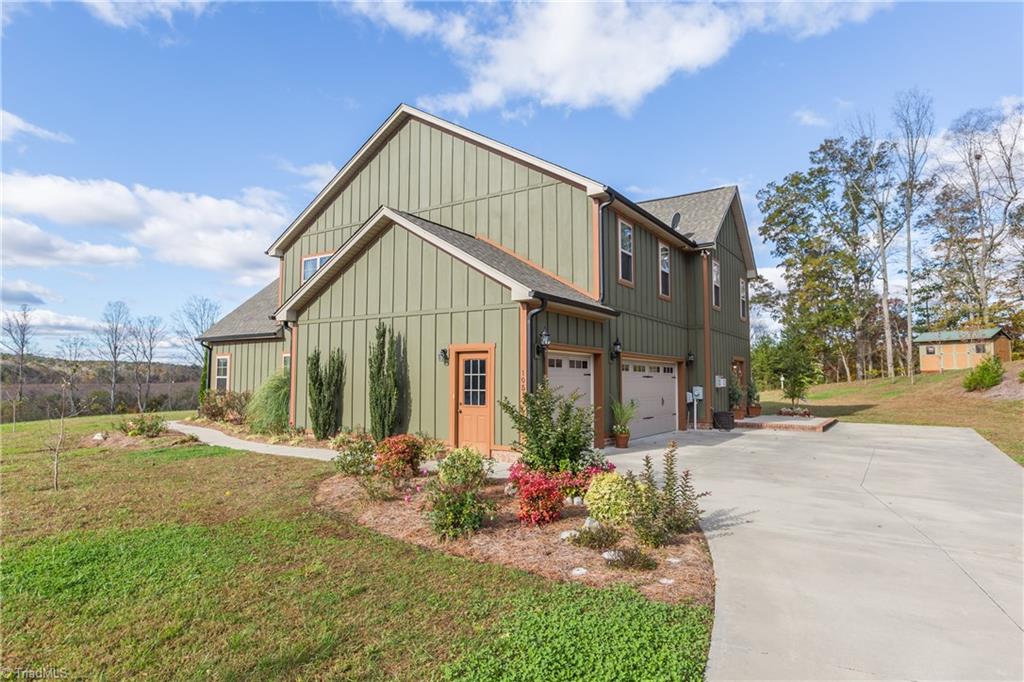 105 Mountain Ridge Court King, NC 27021 - Photo 10 of 43 Side entry on the three car garage, storage shed in background