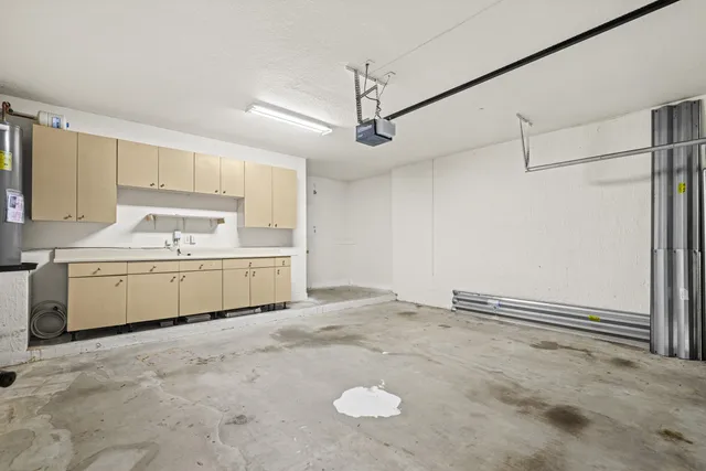 a view of a house with a big yard and coconut trees
