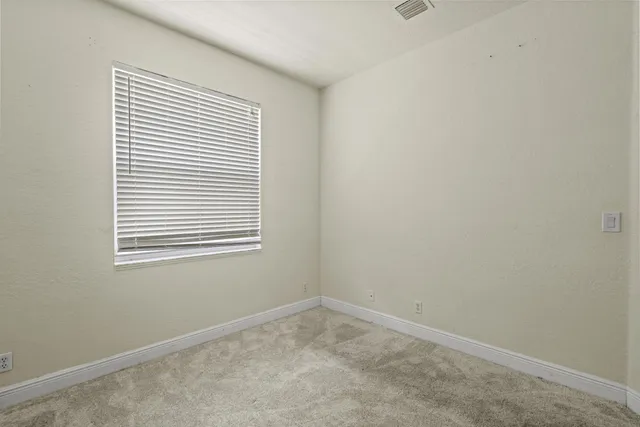 an empty room with closet area