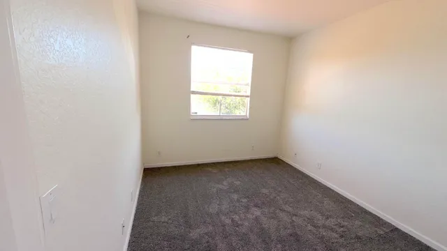 a view of a hallway with an entryway