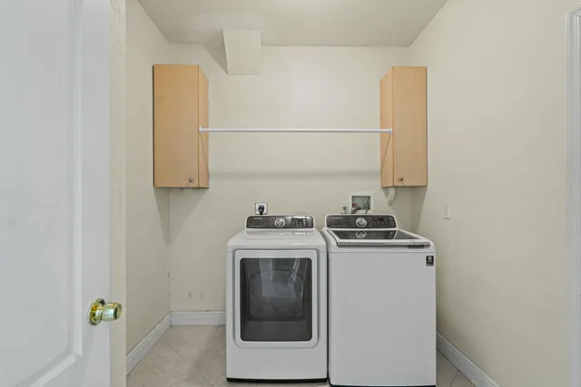 a stove top oven sitting inside of a kitchen