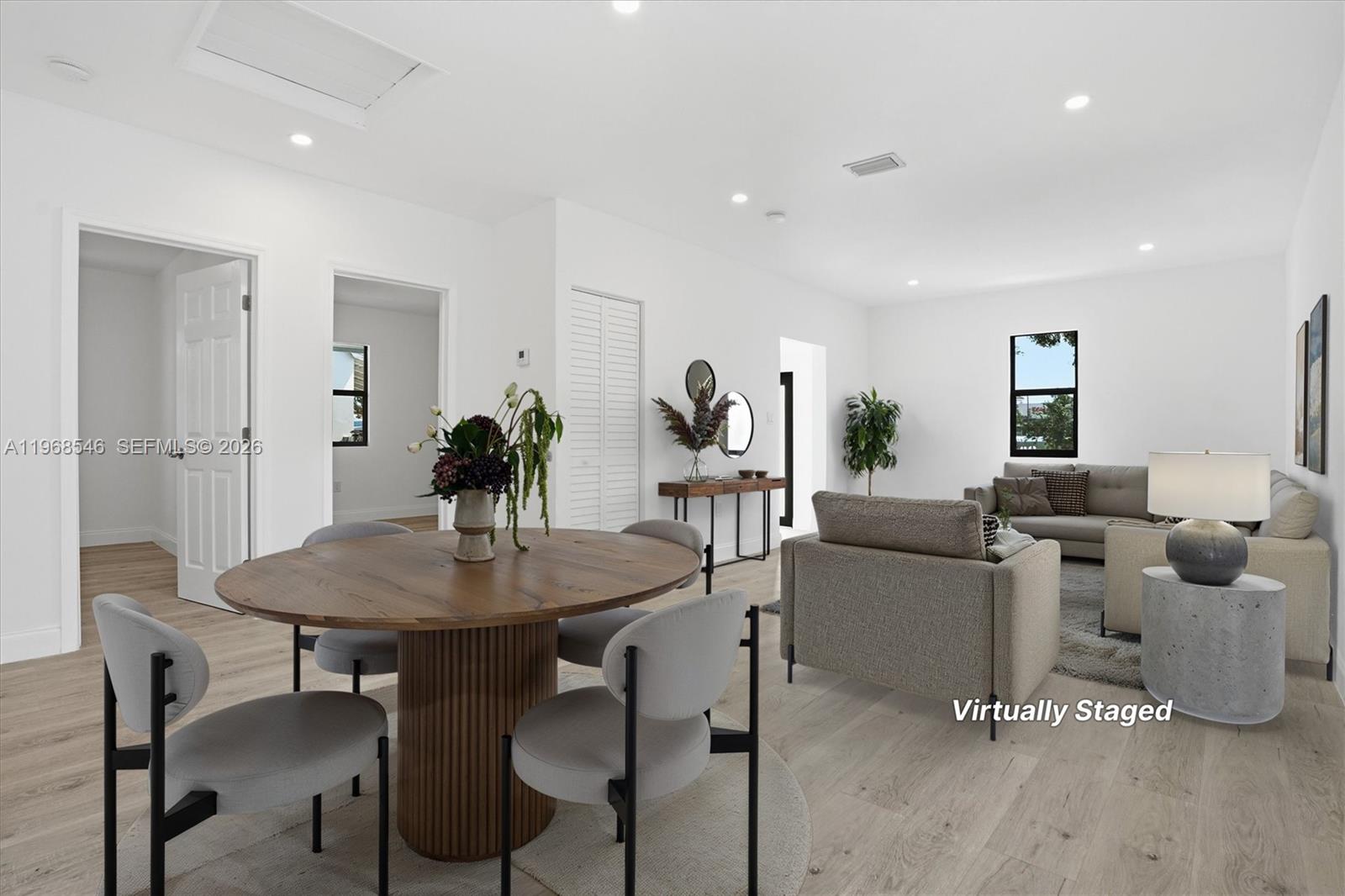 4237 Southwest 7th Street Miami, FL 33134 - Photo 3 of 31 a view of a dining room with furniture and wooden floor