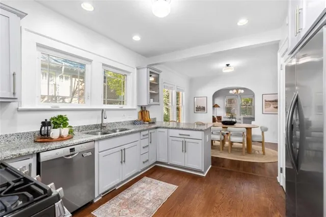 a kitchen with a sink cabinets and window