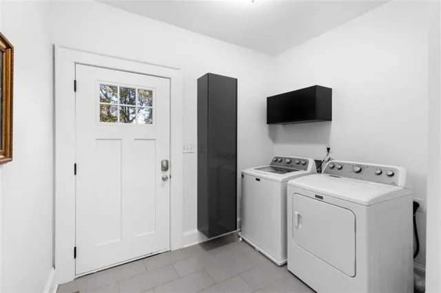 a view of storage and utility room with washer and dryer