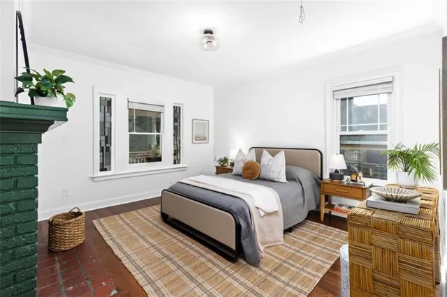 a bedroom with a bed and a couch