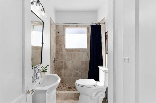 a bedroom with double bed and a window