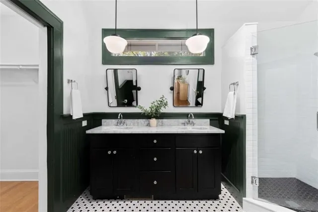 a bathroom with a sink a toilet and mirror