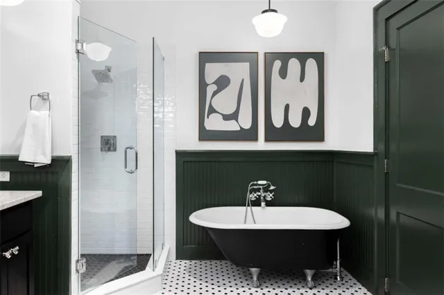 a bathroom with a sink a light fixture and a mirror