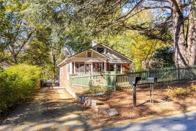 a view of a room with wooden floor and windows