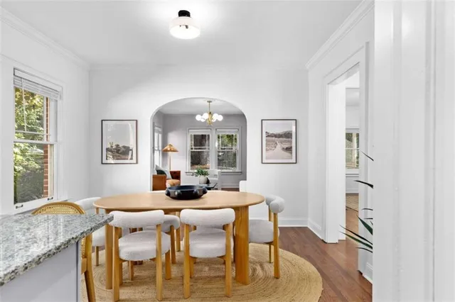 a view of a dining room with furniture window and wooden floor