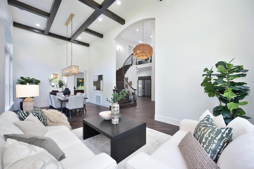 9042 Cedar Ridge Drive Granite Bay, CA 95746 - Photo 11 of 96 a living room with furniture a chandelier and a window