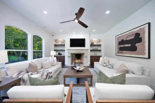 a kitchen with stainless steel appliances granite countertop a sink a stove and cabinets