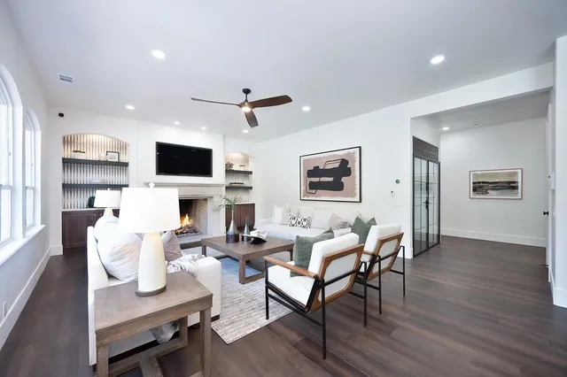 a living room with furniture and a potted plant