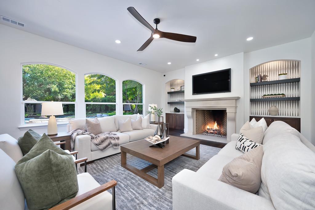 9042 Cedar Ridge Drive Granite Bay, CA 95746 - Photo 20 of 96 a living room with furniture fireplace and a large window