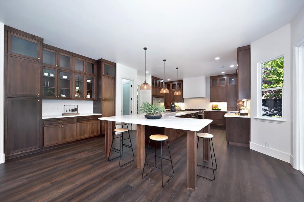 9042 Cedar Ridge Drive Granite Bay, CA 95746 - Photo 25 of 96 a kitchen with a sink cabinets and wooden floor