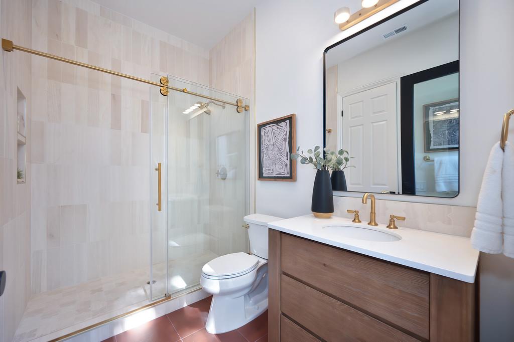 9042 Cedar Ridge Drive Granite Bay, CA 95746 - Photo 48 of 96 a bathroom with a sink a toilet a mirror and shower