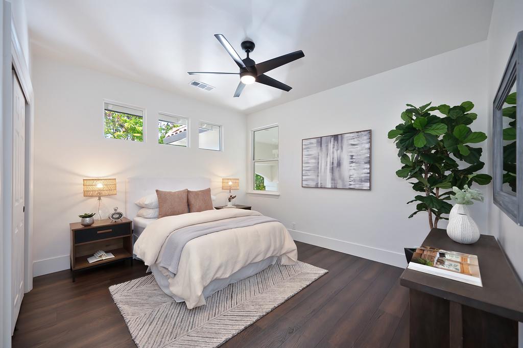 9042 Cedar Ridge Drive Granite Bay, CA 95746 - Photo 56 of 96 a bedroom with a bed and a potted plant