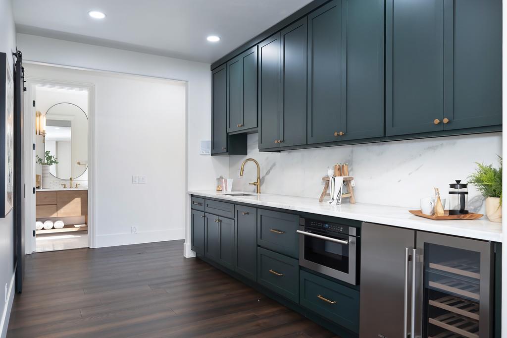 9042 Cedar Ridge Drive Granite Bay, CA 95746 - Photo 59 of 96 a kitchen with stainless steel appliances granite countertop a sink a stove and cabinets