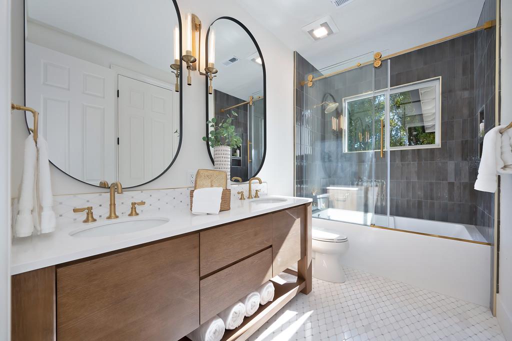 9042 Cedar Ridge Drive Granite Bay, CA 95746 - Photo 66 of 96 a bathroom with a double vanity sink mirror and shower