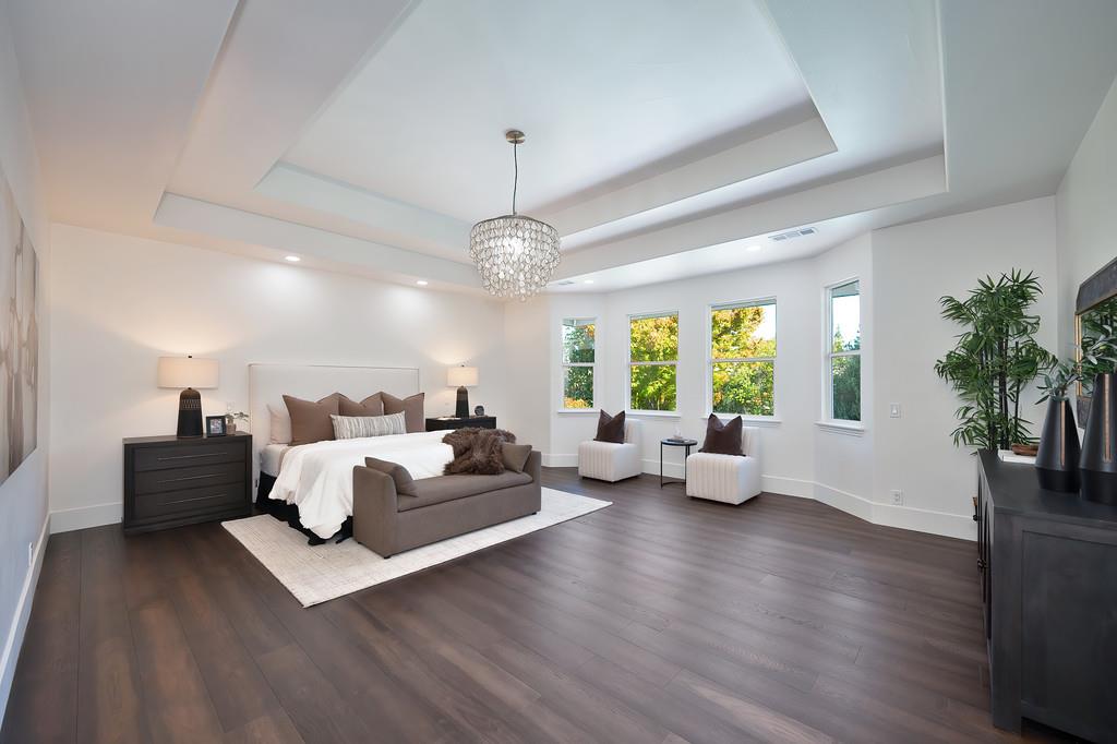 9042 Cedar Ridge Drive Granite Bay, CA 95746 - Photo 69 of 96 a living room with furniture or chandelier and a wooden floor