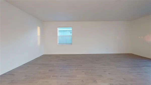 an empty room with a empty space and window