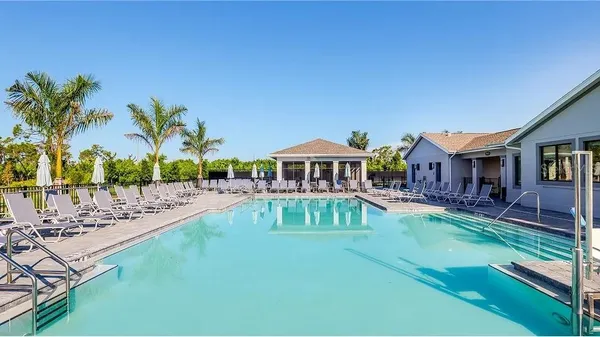 a front view of house with yard and outdoor seating