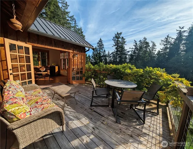 a view of a patio with table and chairs and potted plants