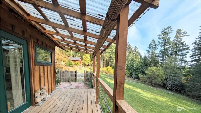 a view of balcony with wooden floor and outdoor space