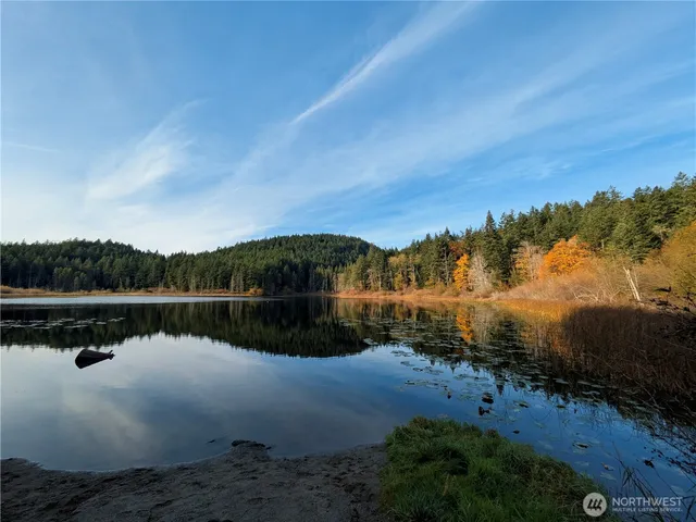 a view of lake with green space