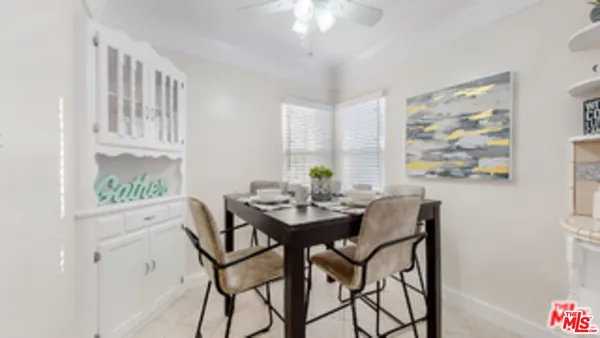 a view of a dining room with furniture and window