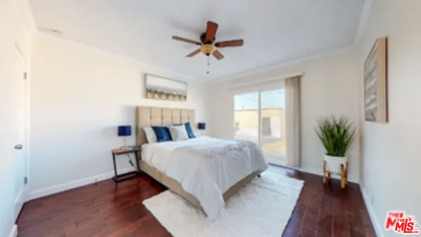 a living room with a bed furniture and a window