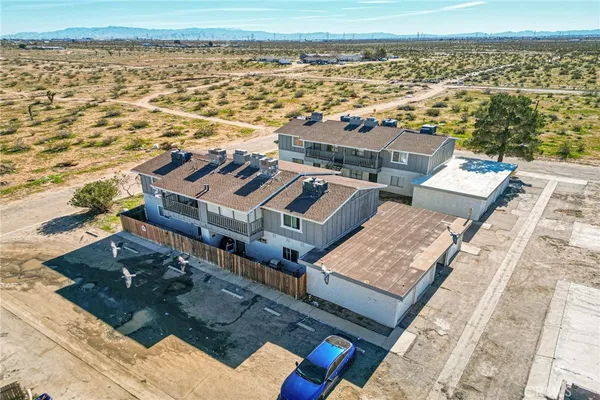 an aerial view of residential building and ocean