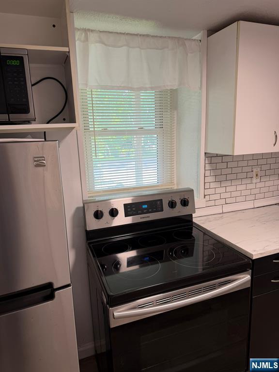 1283 Valley Road, Unit 7 Montclair, NJ 07043 - Photo 12 of 26 a stove top oven sitting inside of a kitchen
