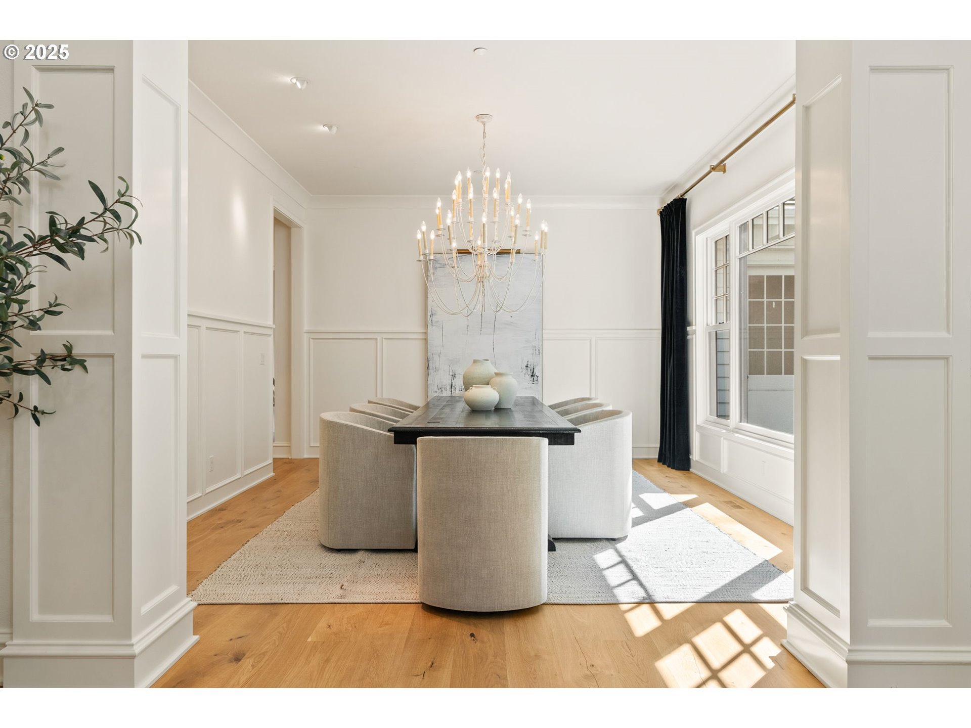 1819 South Radcliffe Road Portland, OR 97219 - Photo 12 of 48 a dining room with a window and chandelier