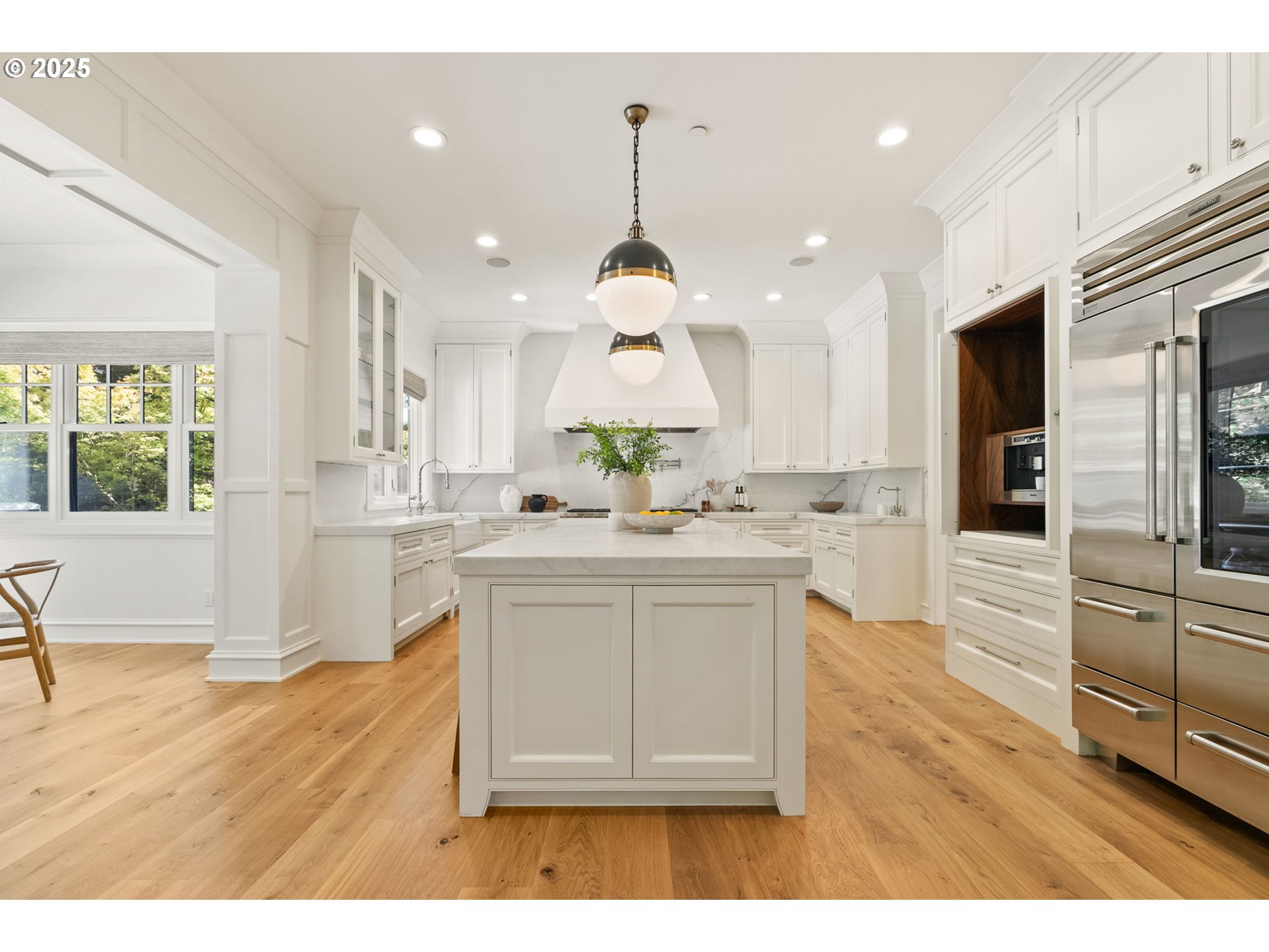 1819 South Radcliffe Road Portland, OR 97219 - Photo 16 of 48 a kitchen with stainless steel appliances granite countertop a stove a sink dishwasher and a wooden floor