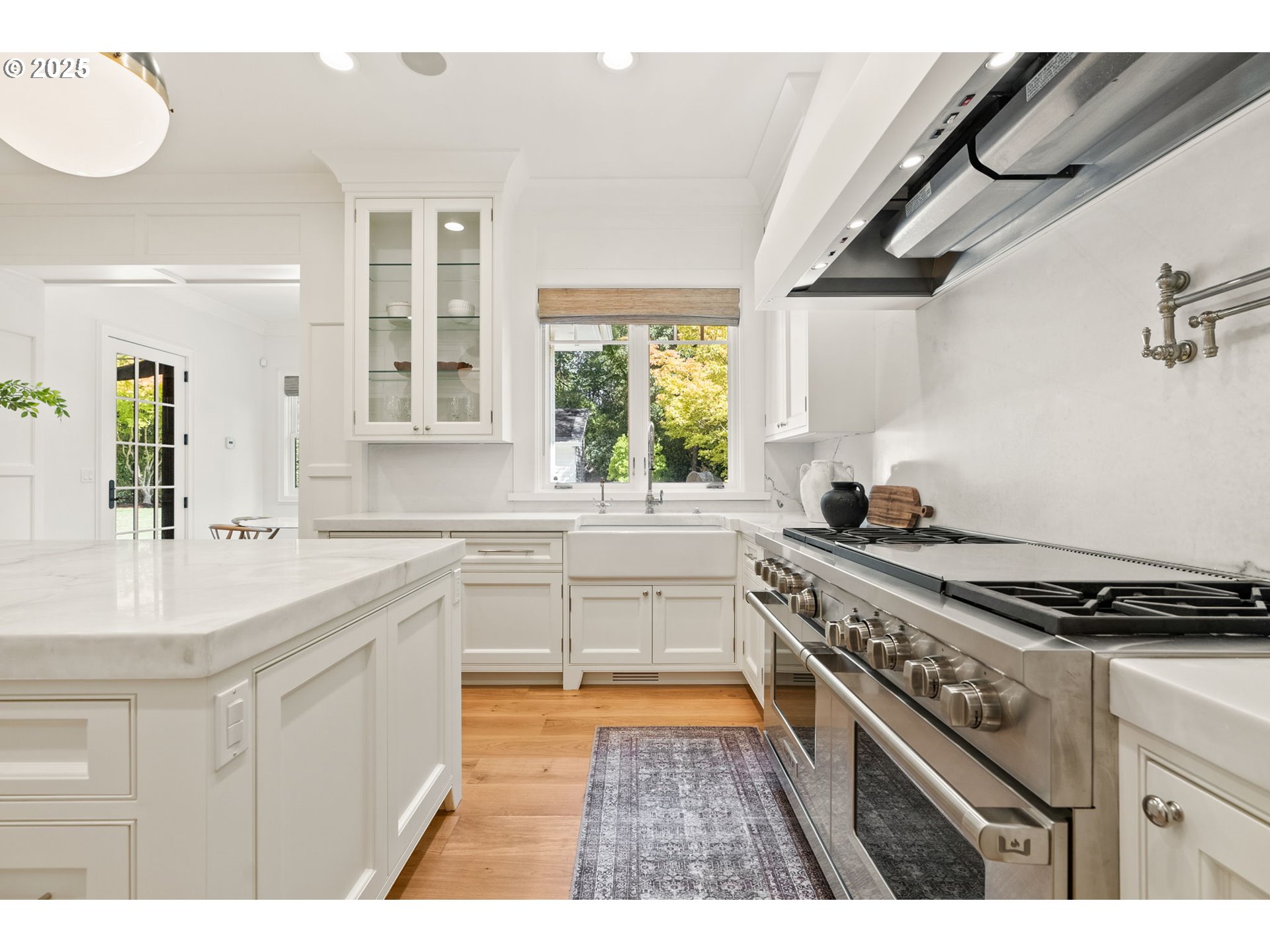 1819 South Radcliffe Road Portland, OR 97219 - Photo 19 of 48 a kitchen with a stove a sink and a wooden cabinets