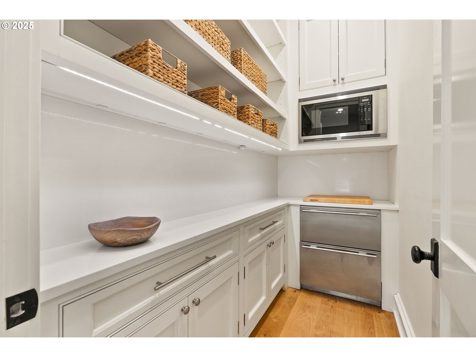 1819 South Radcliffe Road Portland, OR 97219 - Photo 21 of 48 a kitchen with white cabinets and appliances